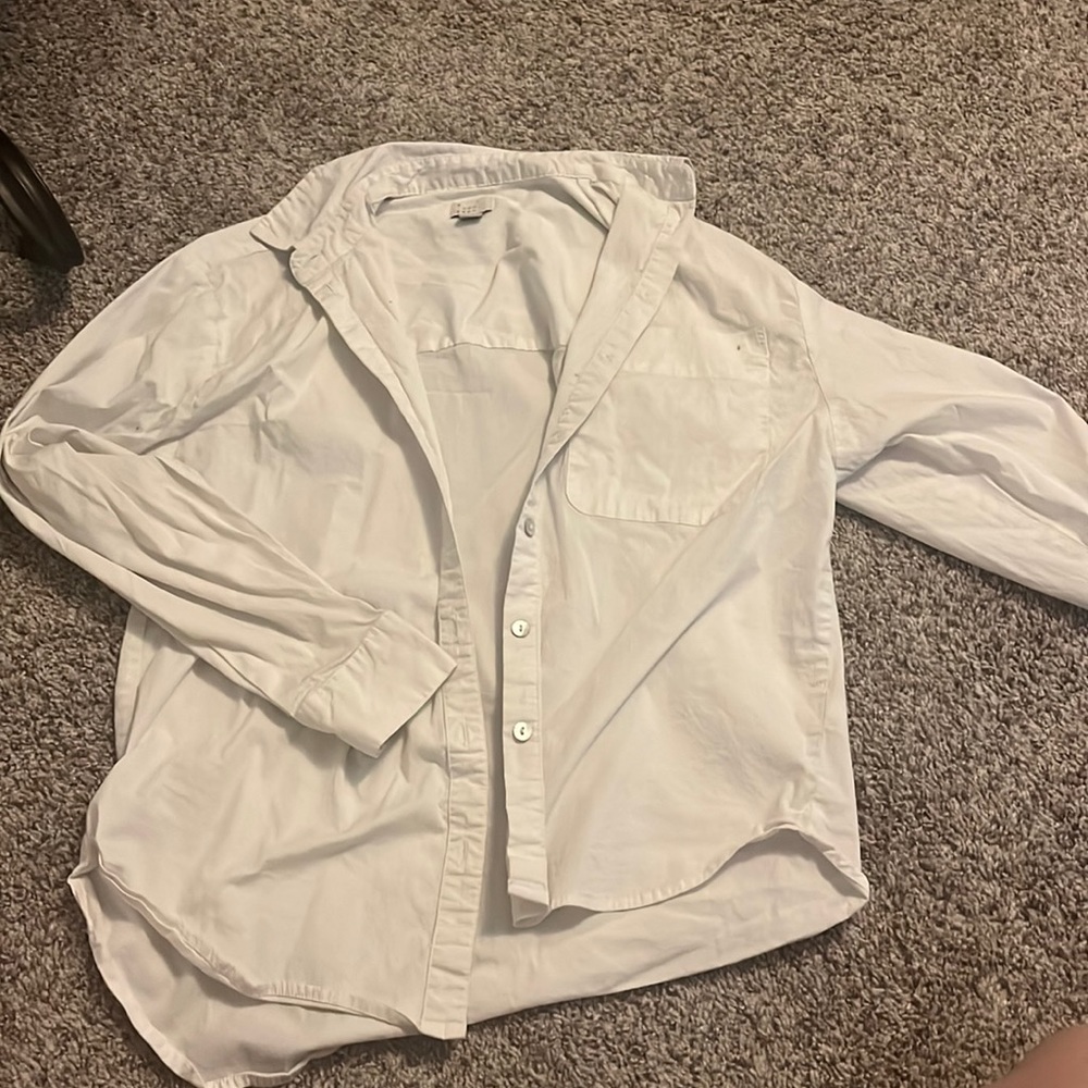 This white button down is a cute addition to any of your clothes!